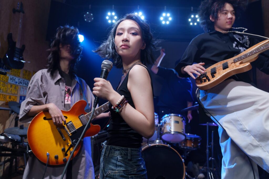 A,Young,Band,Performing,On,Stage