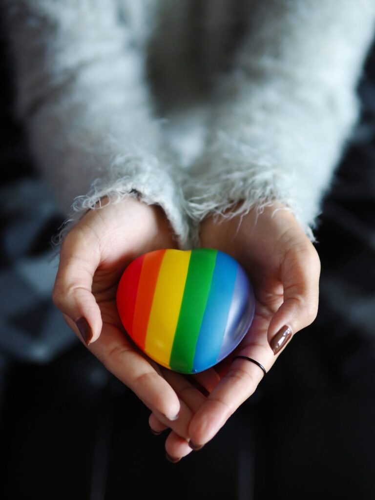 Pride,Theme,,Lgbtq+,Friendly,People.,Female,Hands,Holding,Rainbow,Colored