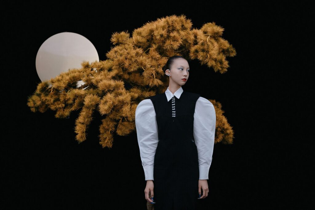 Elegant,Woman,In,High,Fashion,Outfit,With,Dramatic,Background,Featuring