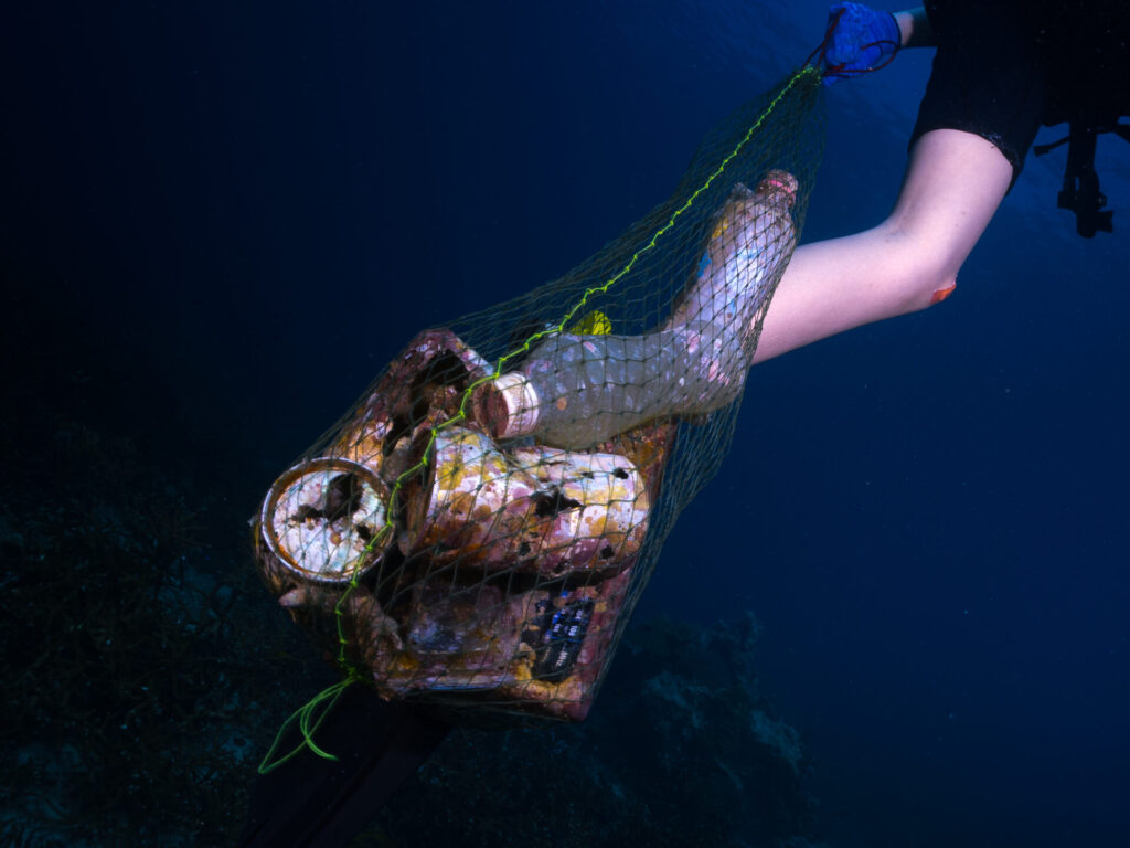 Scuba,Diver,With,A,Bunch,Of,Underwater,Trashes,And,Leftover