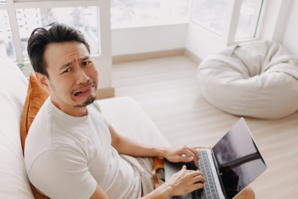 Freelance,Asian,Man,Sad,With,The,Result,In,His,Laptop.