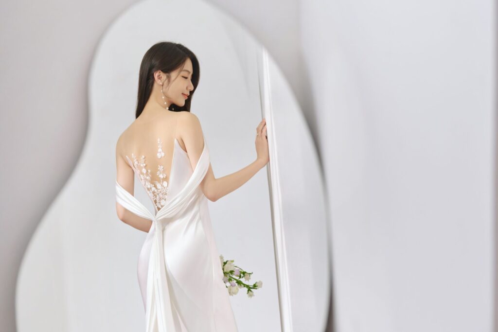Elegant,Bride,In,A,Backless,Wedding,Gown,With,Floral,Embroidery